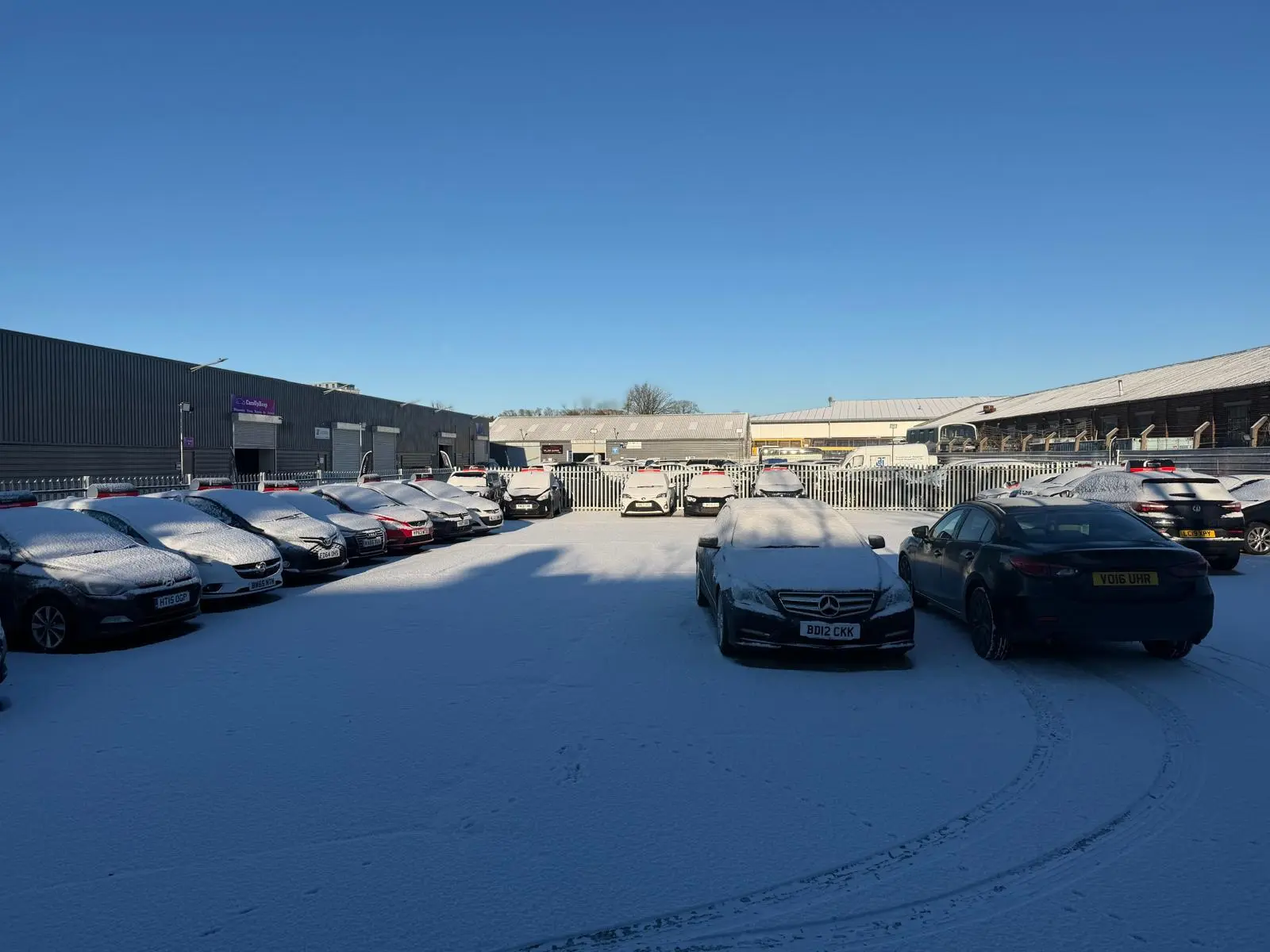 Happy customers at car dealership